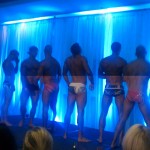 Men standing on stage in their underwear for the underwear charity auction